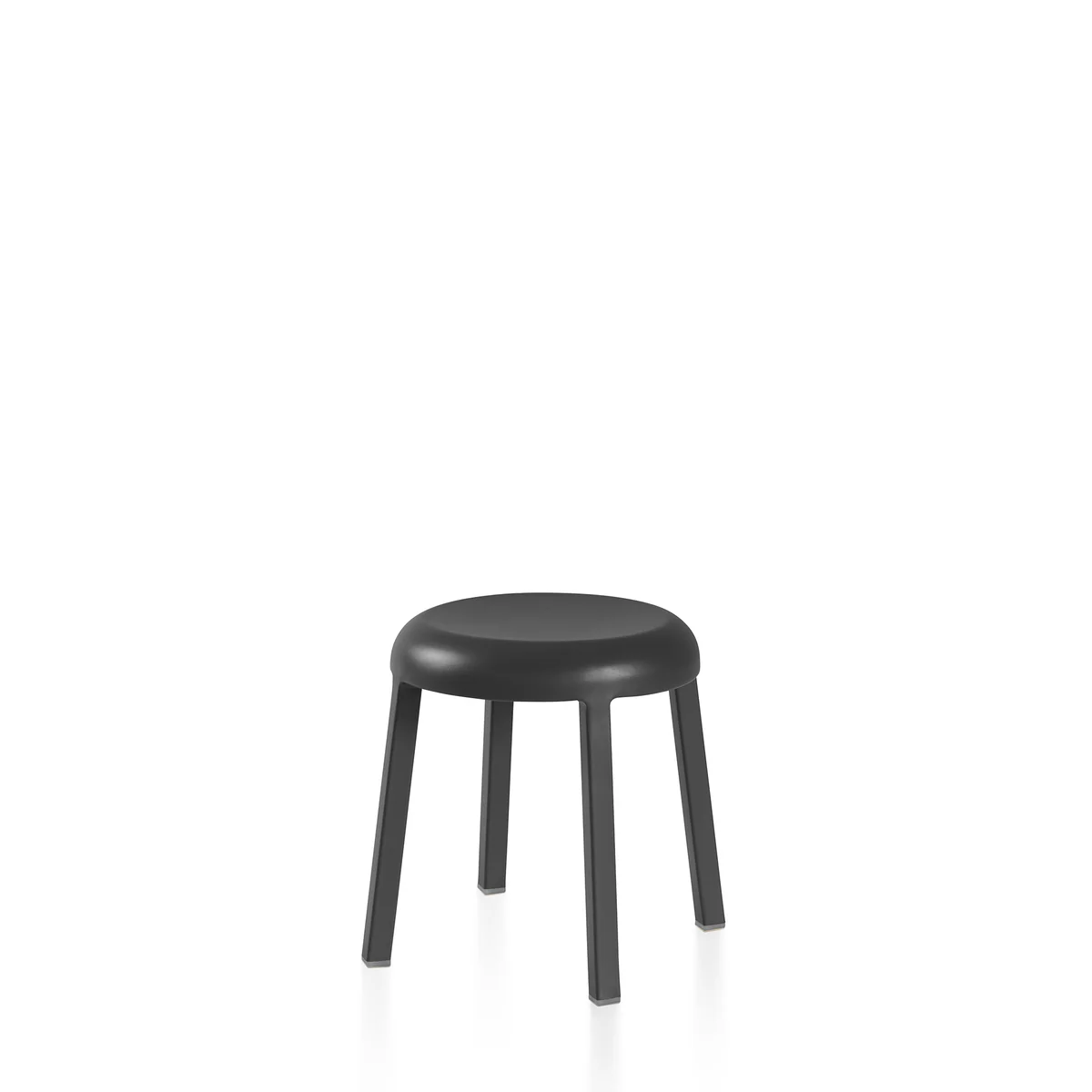 Za Mini Stool in dark grey by Emeco, designed by Naoto Fukasawa, features a compact recycled aluminum frame with a powder-coated finish, suitable for both indoor and outdoor use.
