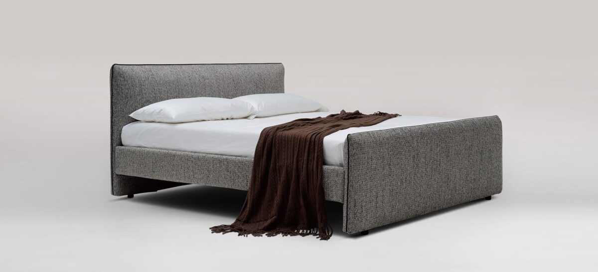 Modern platform bed with clean lines and plush padded headboard by Camerich.