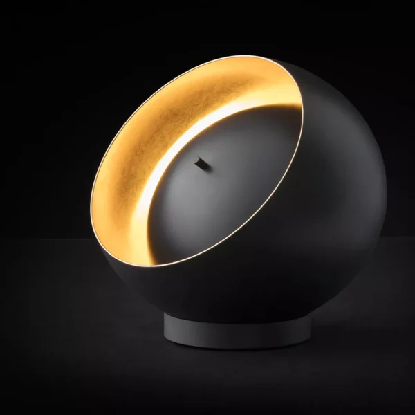 “Eva by Oluce modern Italian table lamp – sleek dome-shaped glass diffuser with minimalist metal base”