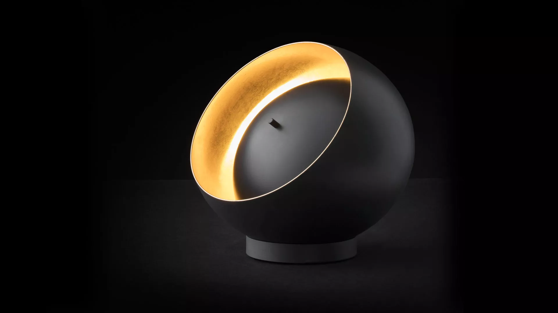“Eva by Oluce modern Italian table lamp – sleek dome-shaped glass diffuser with minimalist metal base”