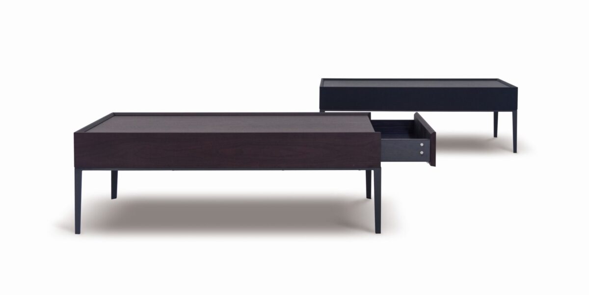 Elegant round dining table with smooth wood top and sleek metal base by Camerich.