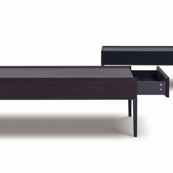 Elegant round dining table with smooth wood top and sleek metal base by Camerich.