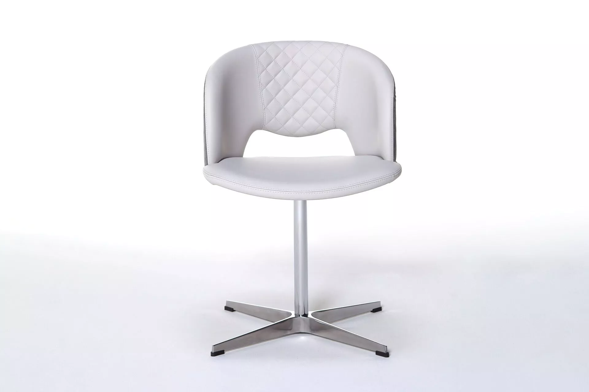 Peressini Fashion Q dining chair with a sleek, modern design, upholstered in premium leather or fabric, and supported by a customizable metal base available in various finishes.