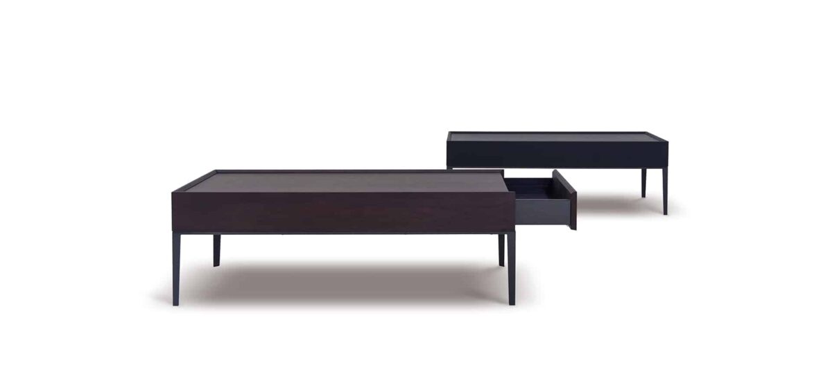 Elegant round dining table with smooth wood top and sleek metal base by Camerich.
