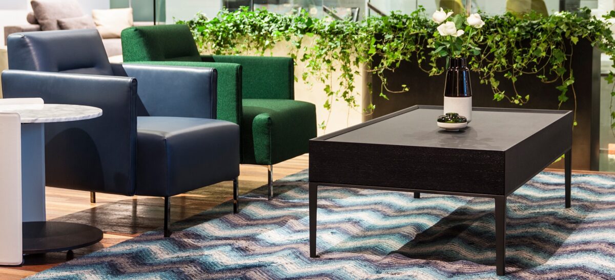 Elegant round dining table with smooth wood top and sleek metal base by Camerich.