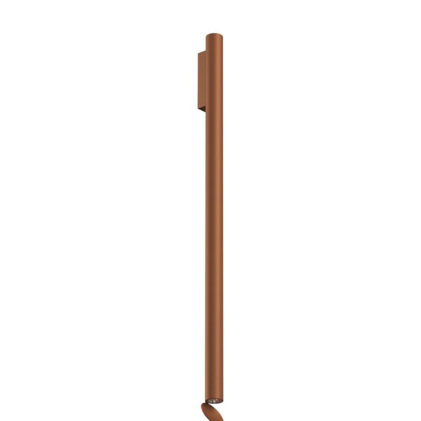 A tall, cylindrical Flos Flauta H1000 Spiga wall lamp in [specify color, e.g., "anodized black" or "anodized copper"], featuring a refined angular etched pattern and dual LED light emission (up and down).