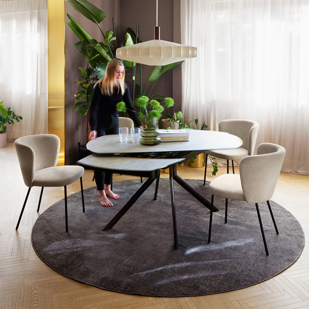 “Side view of GIOVE PLUS table by Connubia – extendable round table with sleek profile and practical functionality”