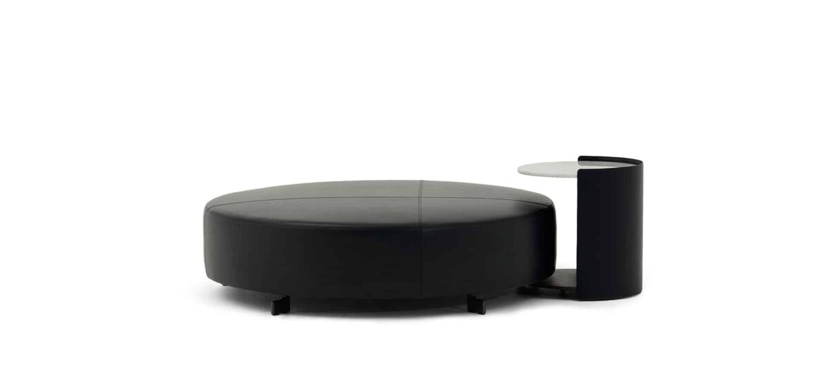 Plush ottoman with stitched detailing