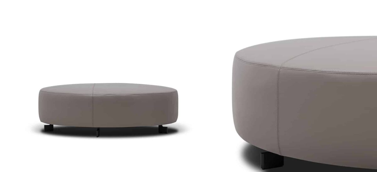 Plush ottoman with stitched detailing