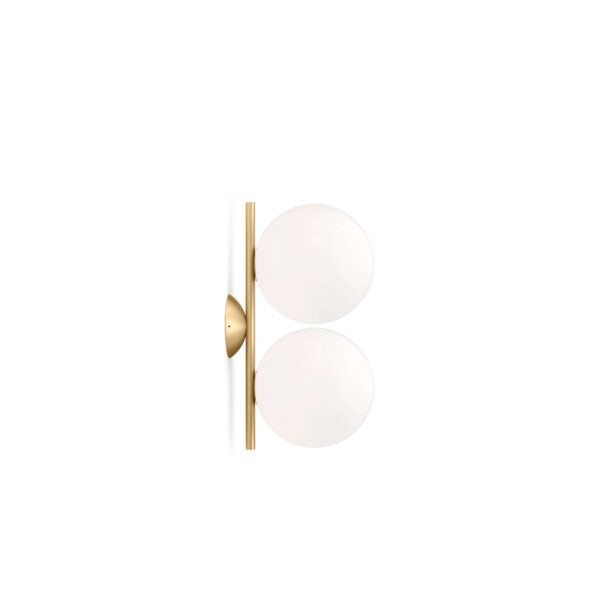 A contemporary Flos IC Lights C/W1 Double wall or ceiling lamp, featuring two spherical white opaline glass diffusers balanced on a slender, vertical metal rod, providing diffused ambient light.