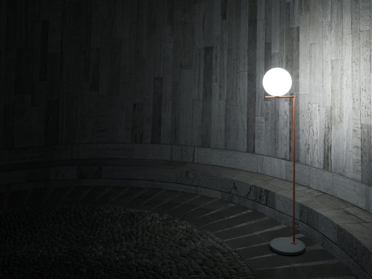 Modern outdoor floor light with a sculptural silhouette, IC F1 H 1350 mm by Flos on a garden path.