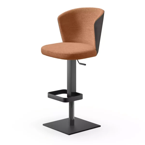 Ines W bar stool by Peressini upholstered in two-tone grey fabric, with wrap-around backrest above a sleek chrome gas-lift column and square base in a modern kitchen.