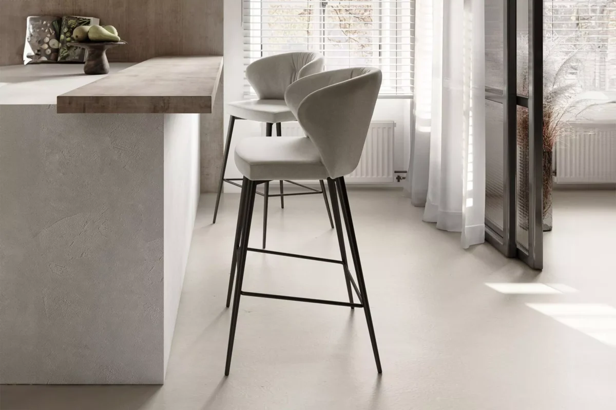 Peressini Ingrid Chair featuring a sleek, ergonomic design with high-density foam padding and a quilted outer backrest, upholstered in luxurious faux leather or real leather.