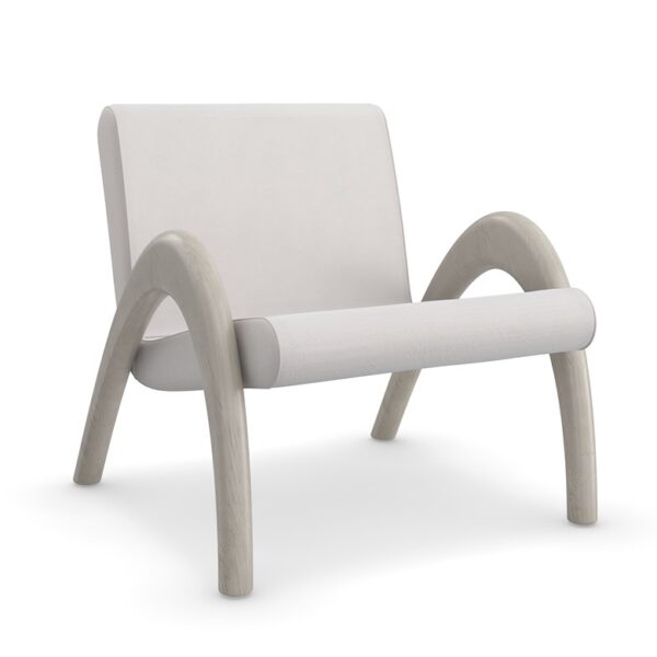 Coco Accent Chair by Caracole featuring a curved ash wood frame in Fossil finish, upholstered in taupe Performance velvet, with a minimalist design and fluid lines, ideal for modern interiors.