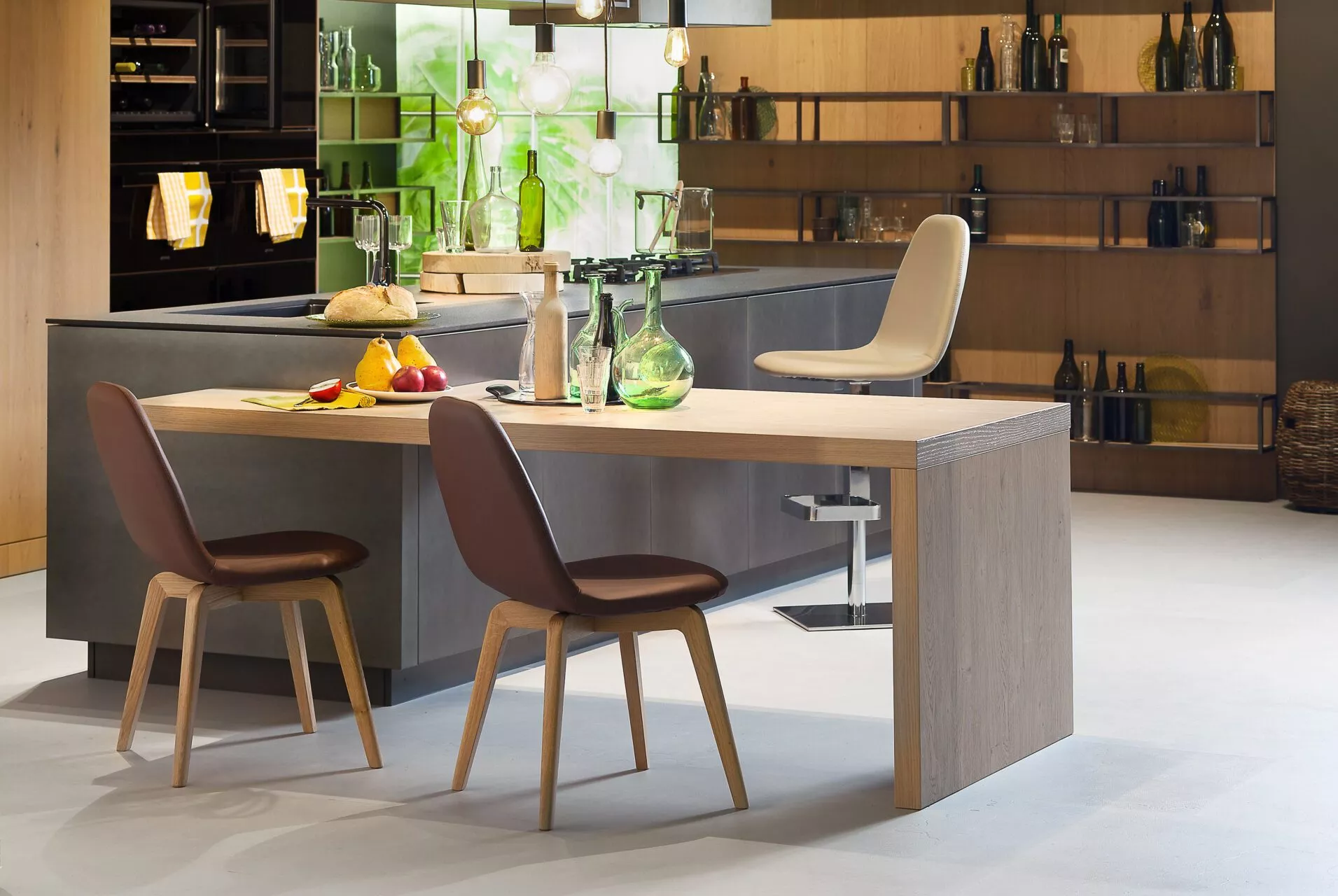 Kube chair by Peressini with a cubic upholstered seat and backrest, supported on slim metal legs in matte black.