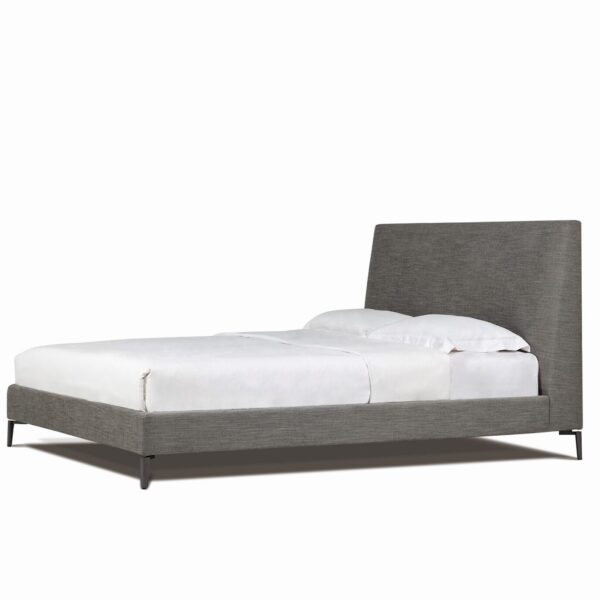 Elegant upholstered bed with curved headboard and minimalist design by Camerich.