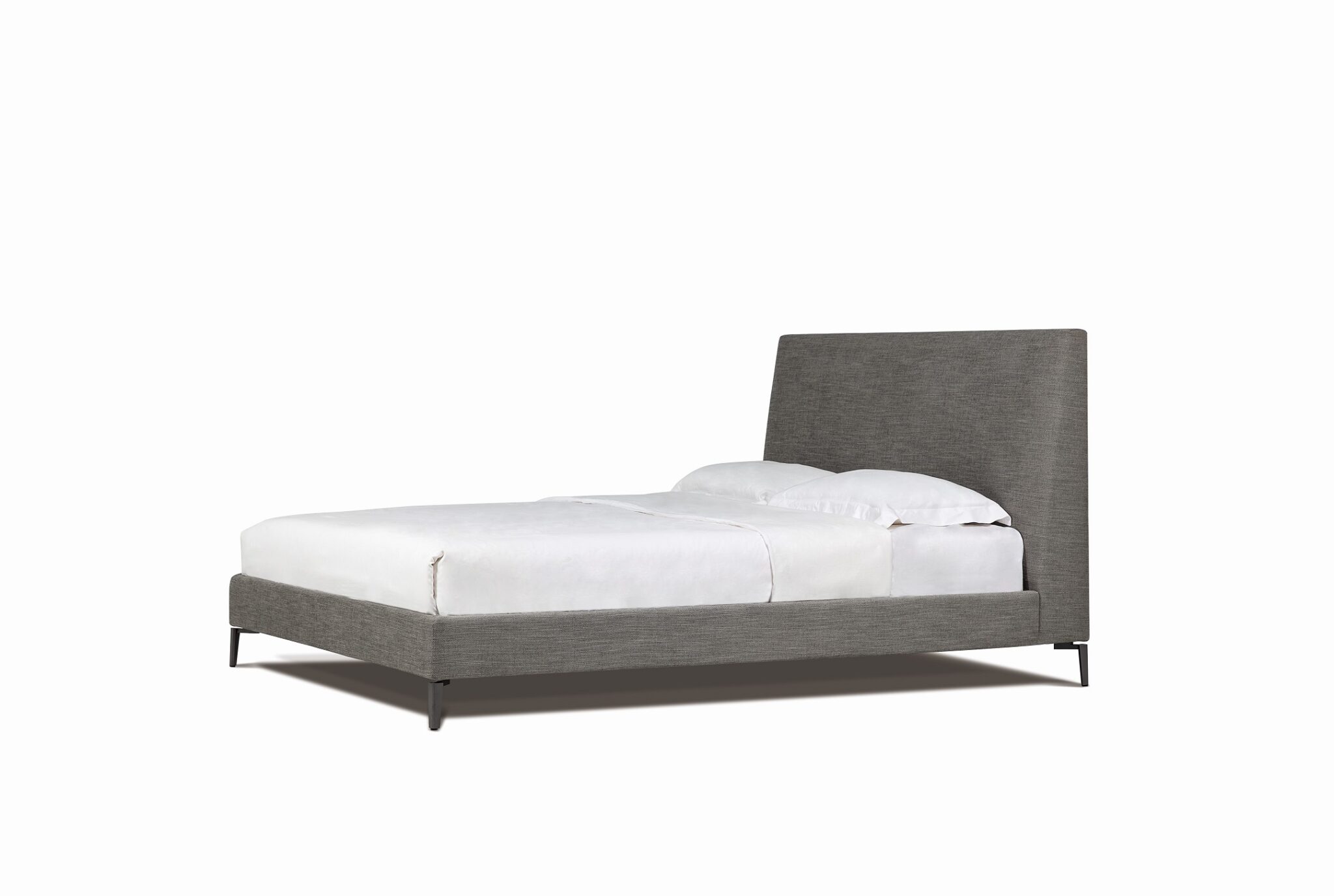Elegant upholstered bed with curved headboard and minimalist design by Camerich.