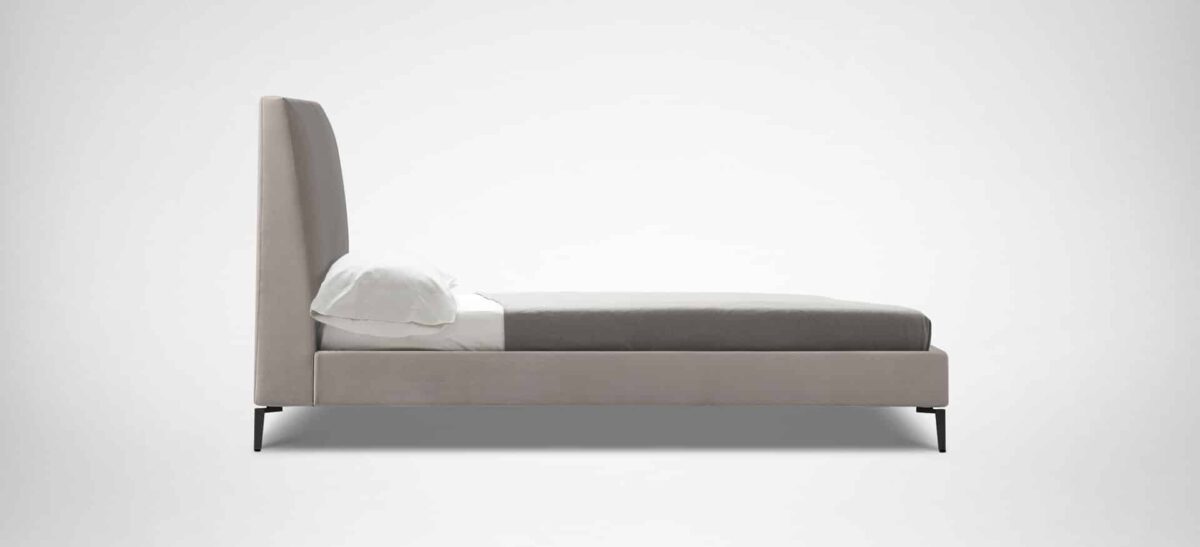 Elegant upholstered bed with curved headboard and minimalist design by Camerich.