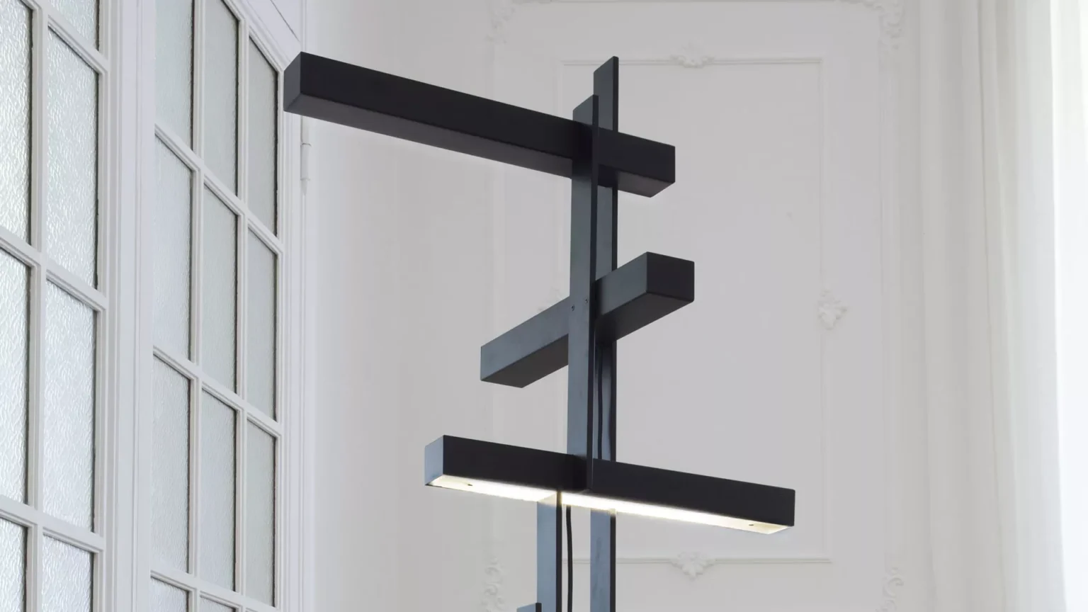“Las by Oluce designer lighting – contemporary table lamp with clean lines, flat diffuser, and architectural structure”