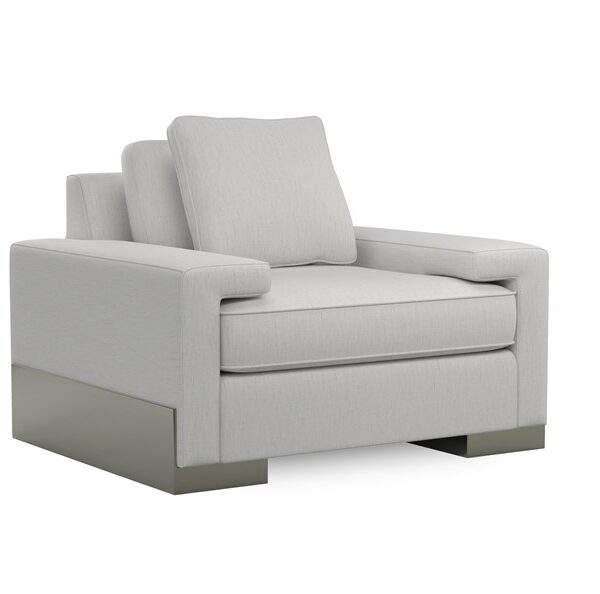 Modern accent chair featuring a wide shelf arm and angular wood base finished in Pyrite, offering a contemporary touch to living spaces.