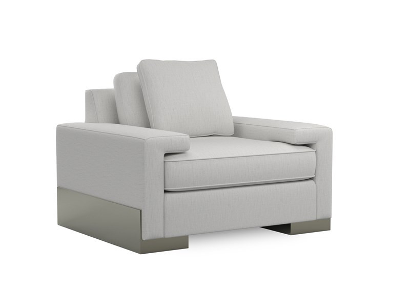 Modern accent chair featuring a wide shelf arm and angular wood base finished in Pyrite, offering a contemporary touch to living spaces.
