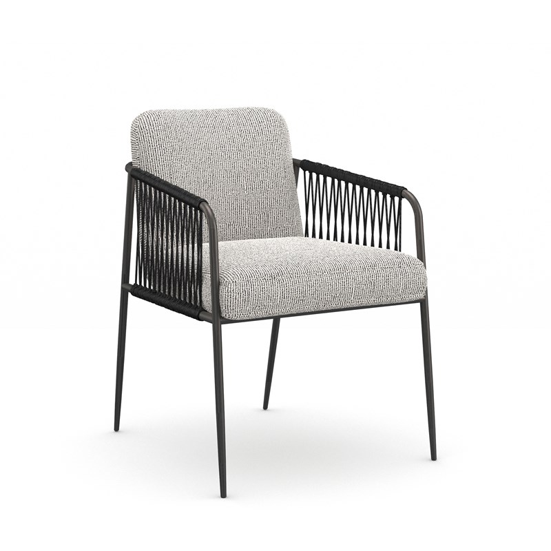 Remix Woven Dining Chair by Caracole featuring an intricately woven backrest and wooden frame.