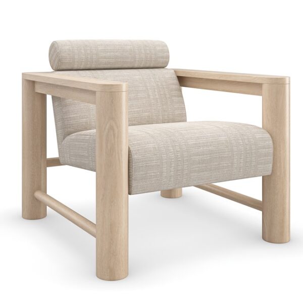 Caracole Unity Lounge Chair, featuring a pillared Sun Drenched Oak wood frame, light-colored upholstered seat and back, and a distinctive Lucent Bronze Metallic metal plate on the backrest.