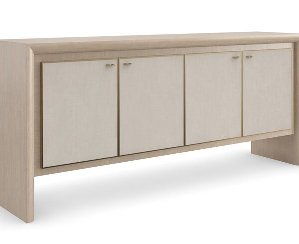 Unity Credenza by Caracole — a sleek storage piece with a sculpted front and metallic accents.