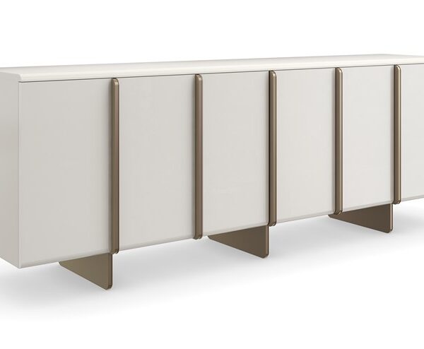 Emphasis Credenza by Caracole — a sleek modern storage piece with a sculptural facade and metallic accents.