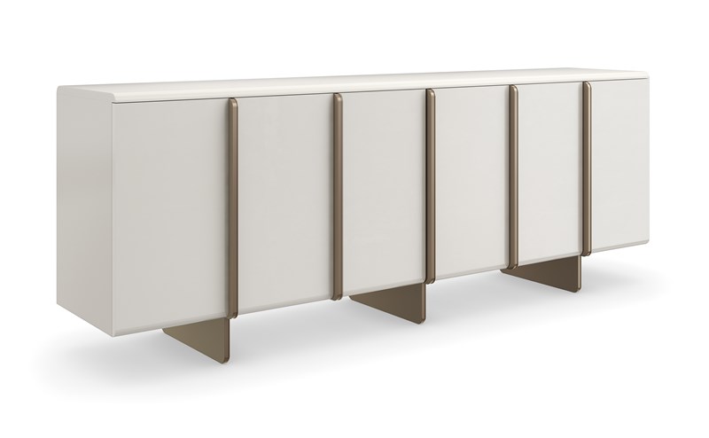 Emphasis Credenza by Caracole — a sleek modern storage piece with a sculptural facade and metallic accents.
