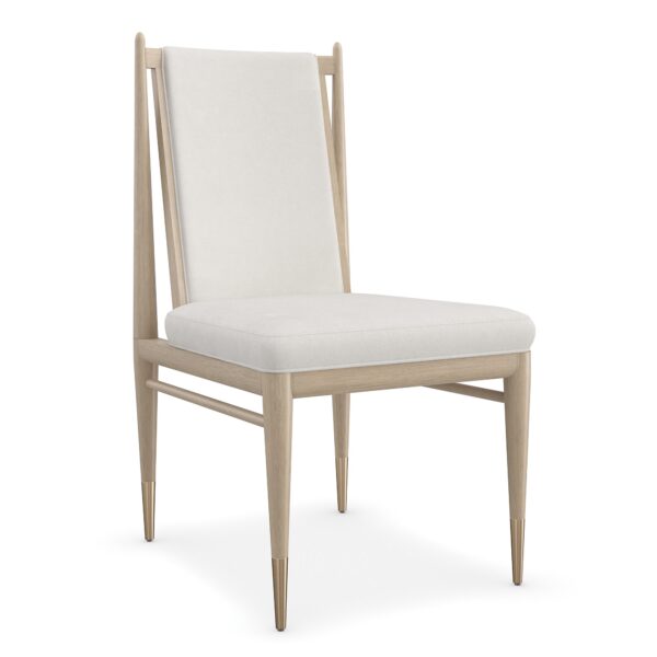 Stylish and sophisticated Unity Light Dining Chair by Caracole, featuring a sleek design with luxurious upholstery and elegant detailing for a modern dining space.