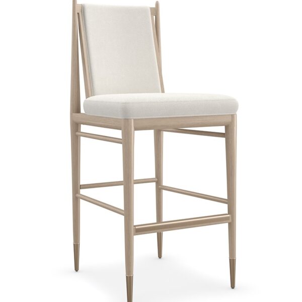 Unity Light Bar Stool by Caracole featuring a curved backrest and light upholstered seat.