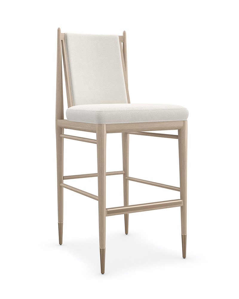 Unity Light Bar Stool by Caracole featuring a curved backrest and light upholstered seat.