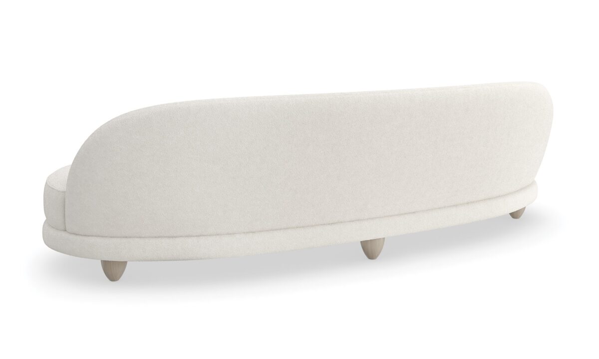 Caracole 110 Tulum Sofa, modern curved sofa, serpentine sofa, biomorphic design sofa, luxury resort furniture, two-tone boucle sofa, cream contemporary sofa, Sabbia feet sofa.