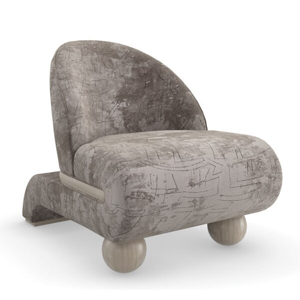Bora Bora chair by Caracole with plush upholstery and rounded backrest.