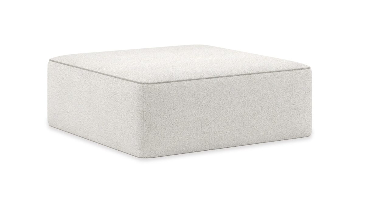 Elegant Marbella Ottoman by Caracole, offering plush seating and a refined design with luxurious upholstery, perfect for adding comfort and style to any living room.