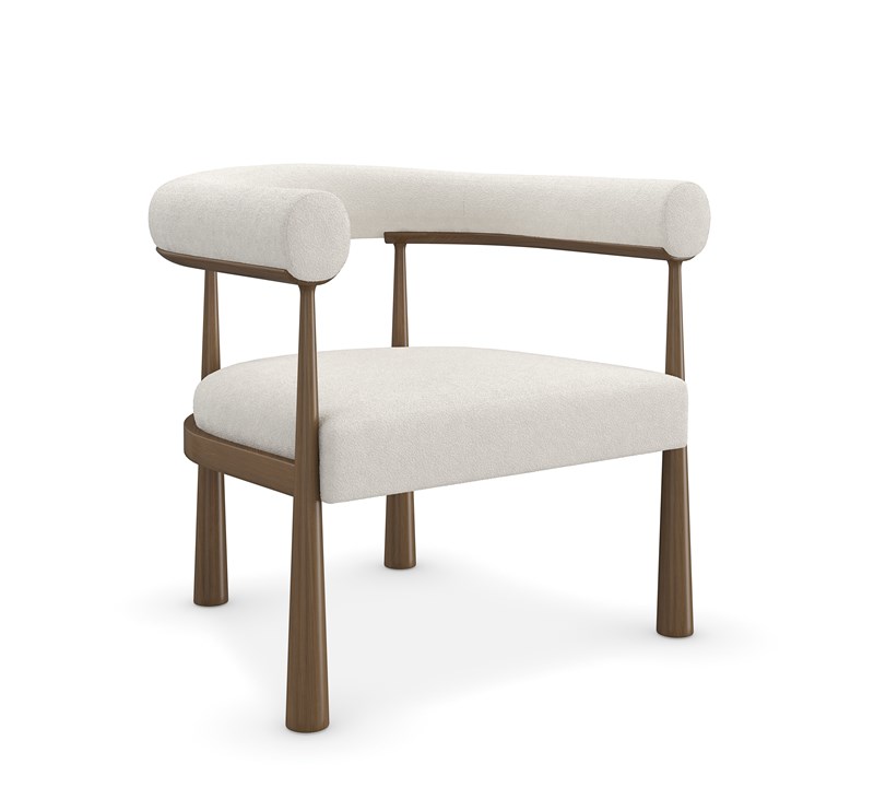 Bali by Caracole accent chair with soft curves and upholstered in neutral fabric.
