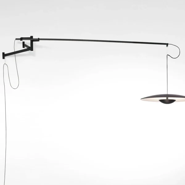 “Modern pendant light Ginger by Marset – sleek wooden disc fixture creating soft ambient glow”