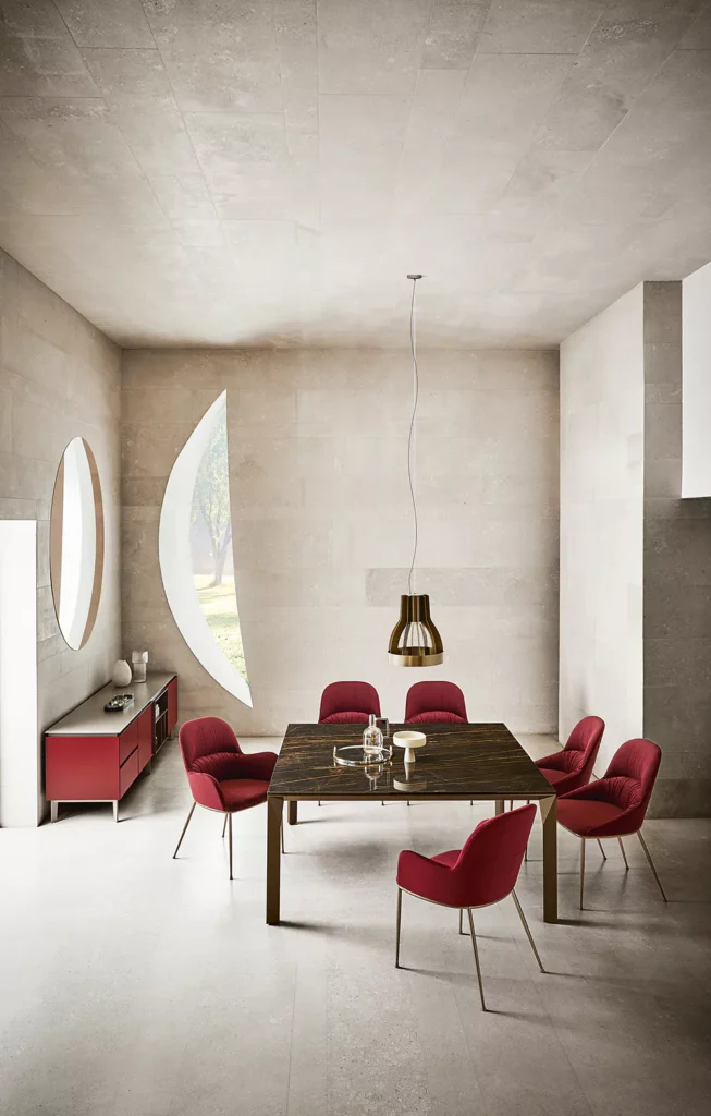 Side angle of Mirage by Bontempi emphasizing its sculptural aluminium base and round-edged barrel shape top in anthracite ceramic.