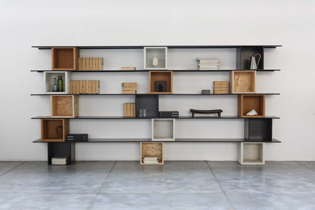 Geometric bookcase with bold steel structure by Zeusnoto.