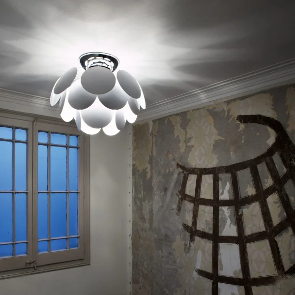 “Modern hanging light Discocó by Marset – playful polka dot design on spherical glass shade”