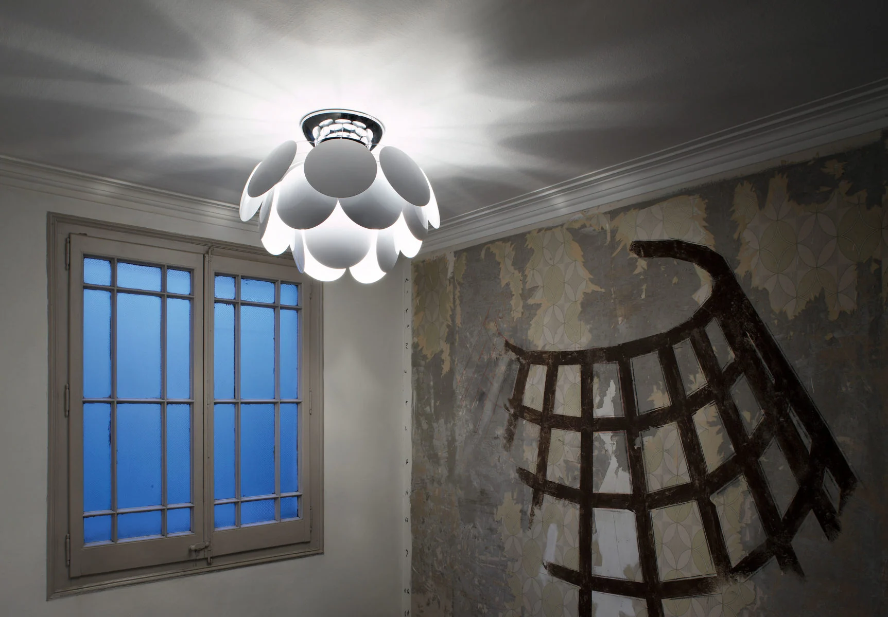 “Modern hanging light Discocó by Marset – playful polka dot design on spherical glass shade”