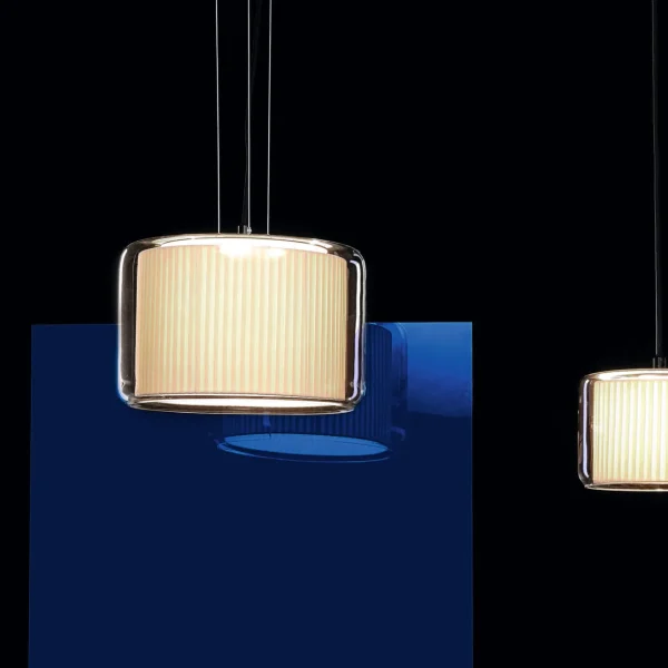 “Contemporary Mercer by Marset table light combining warm textile shade with clear glass design”