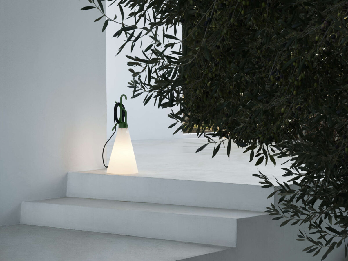 The iconic Flos Mayday Outdoor by Konstantin Grcic, a multi-functional utility lamp featuring a robust, recycled polypropylene construction and an extended power cable for flexibility.