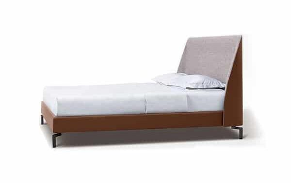 Sleek upholstered bed with soft lines and elegant frame by Camerich.