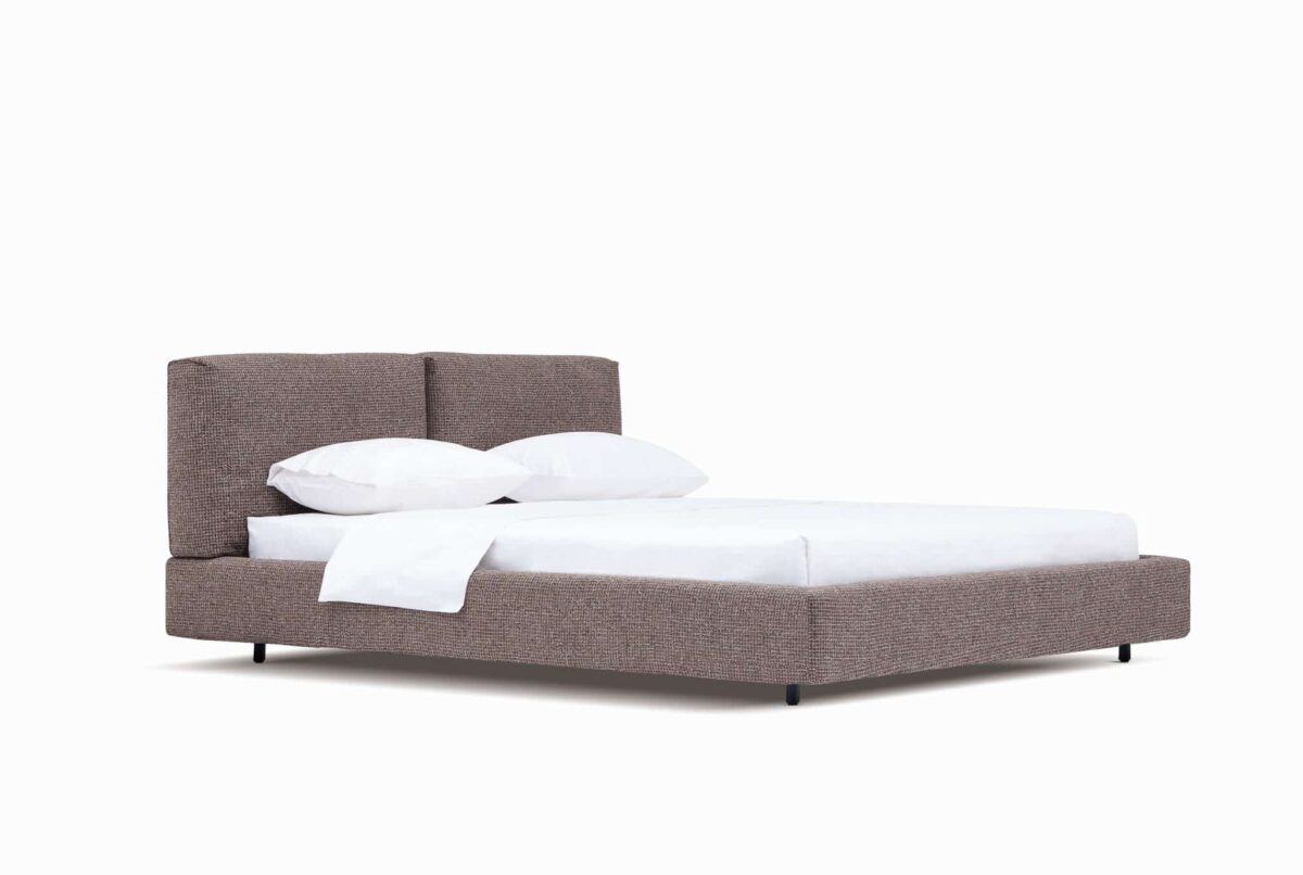 Organic-style bed with natural wood frame and soft upholstered headboard by Camerich.