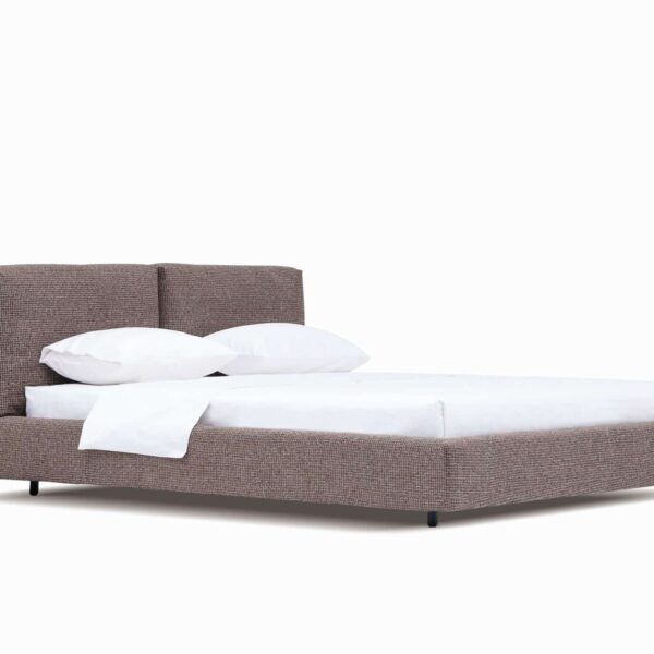 Organic-style bed with natural wood frame and soft upholstered headboard by Camerich.