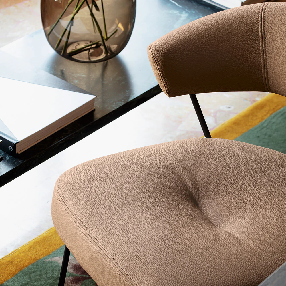 “Side view of NY Anniversary chair by Connubia – elegant Italian seating with slim profile and comfort”