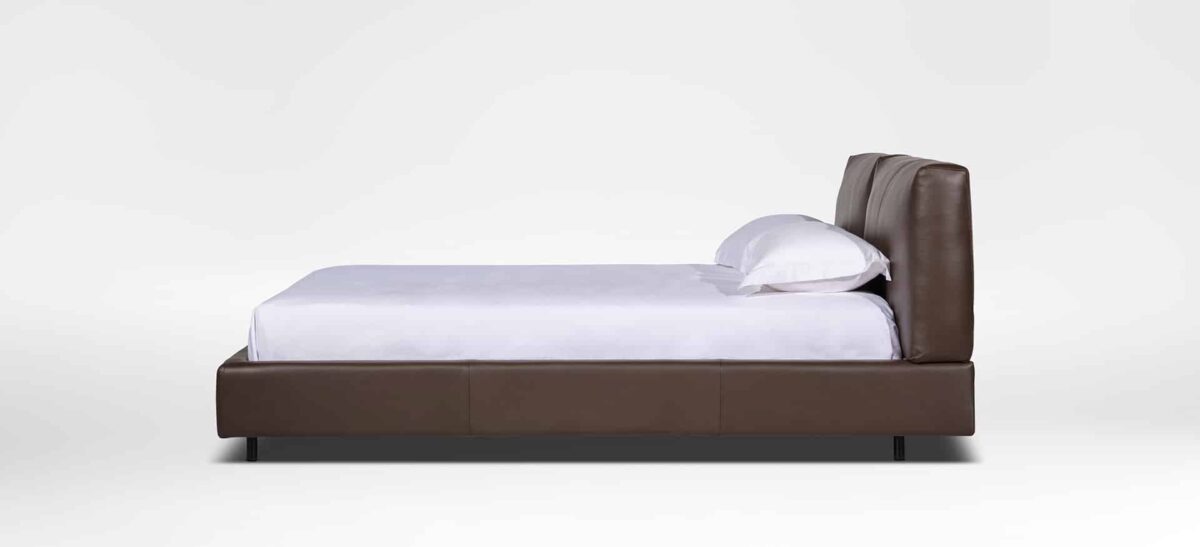 Organic-style bed with natural wood frame and soft upholstered headboard by Camerich.