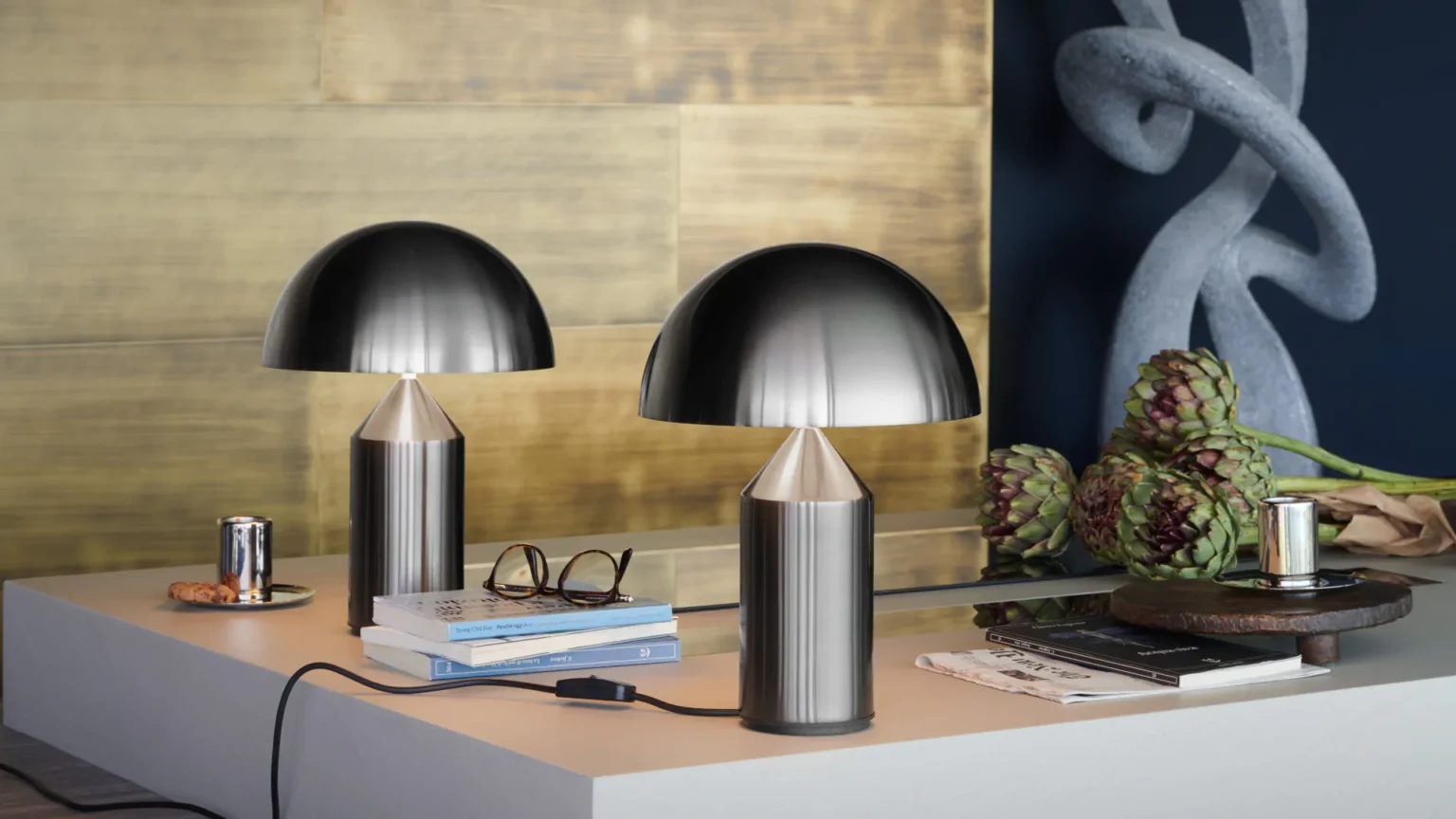 “Atollo Metal by Oluce contemporary designer lighting – sculptural metallic lamp featuring minimalist geometric shapes”